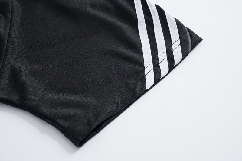 Black mesh athletic tee sleeve with three white stripes and stitched hem detail