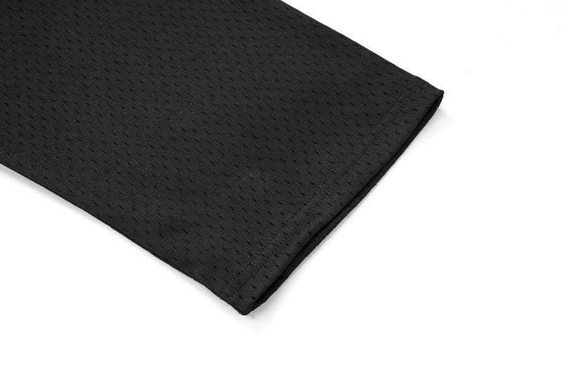 Close-up of black mesh sleeve cuff with textured perforated fabric