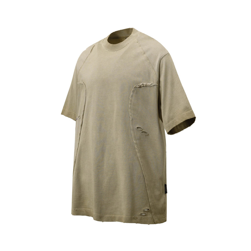Beige distressed panel tee with raglan short sleeves, raw seam details, and washed cotton streetwear look