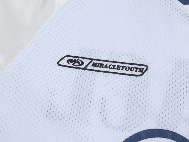 White mesh varsity tee with black streetwear graphic and bold Number 27 print on breathable fabric