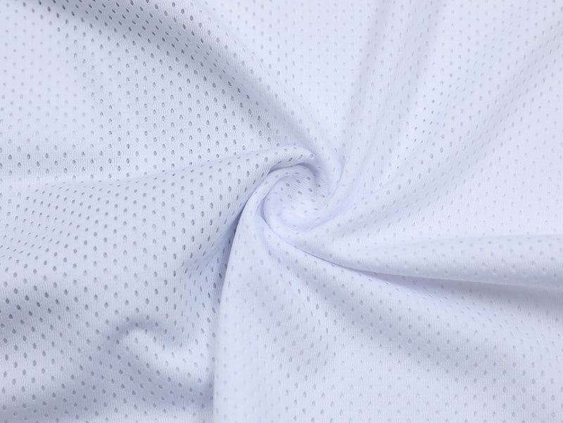 White perforated mesh jersey fabric with soft folds and breathable streetwear texture