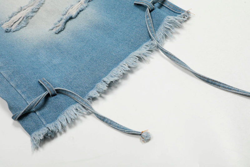 Frayed hem and side tie detail on light wash wide-leg denim jorts