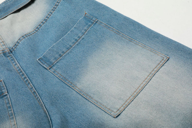 Close-up of back pocket on light wash denim jorts with faded panel detail