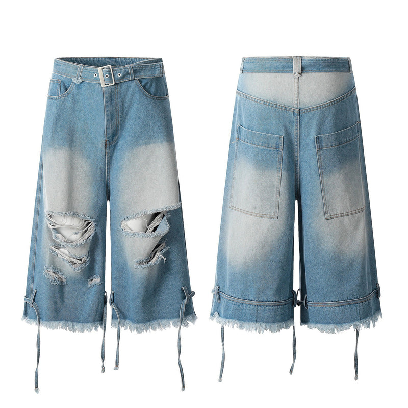 Front and back views of light wash distressed denim jorts with belt and frayed hem
