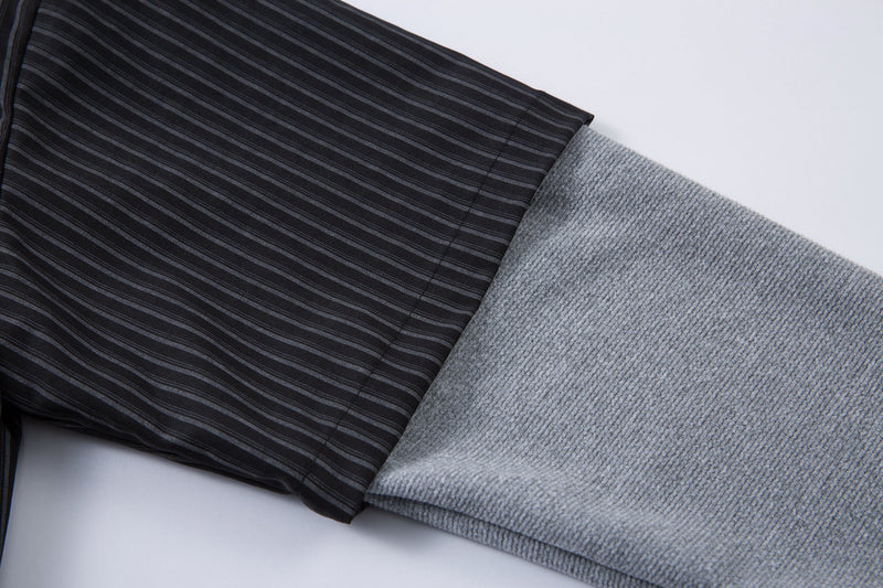 Close-up of black pinstripe sleeve next to gray knit built-in long sleeve