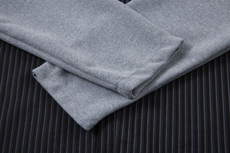 Stacked gray built-in sleeves over black pinstripe shirt fabric