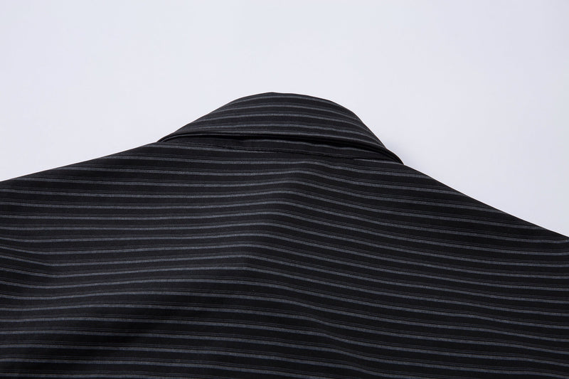 Low-angle view of black pinstripe shirt back with curved shoulder and yoke seam