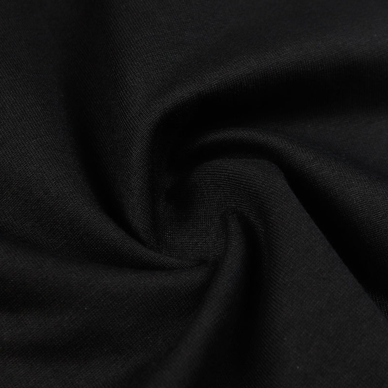 Close-up of black fabric with soft draped texture, matching the Seakoff Saint rhinestone graphic oversized tee