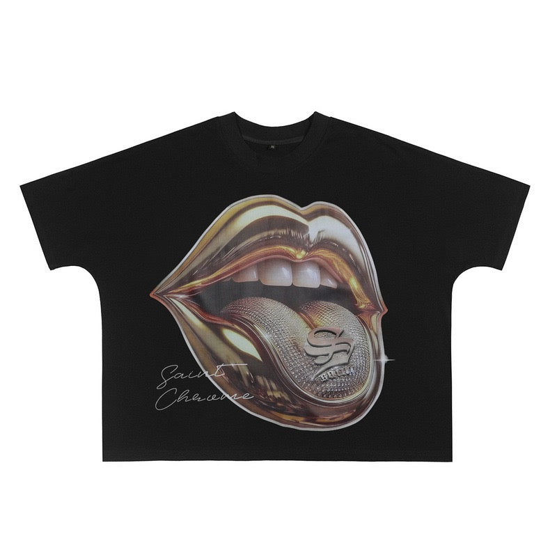Black oversized graphic tee with metallic gold lips and diamond tongue emblem print, Saint Chevarre branding