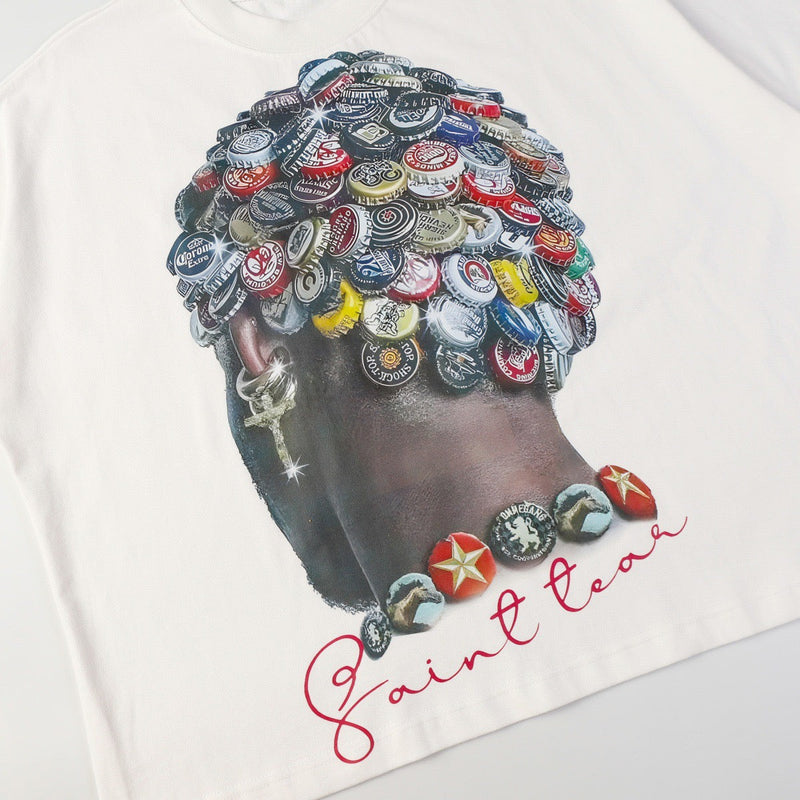 White graphic tee with a portrait made from colorful bottle caps and Saint Toah script lettering