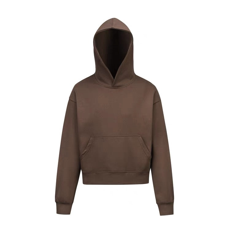Brown cropped hoodie with boxy fit, front view on white background