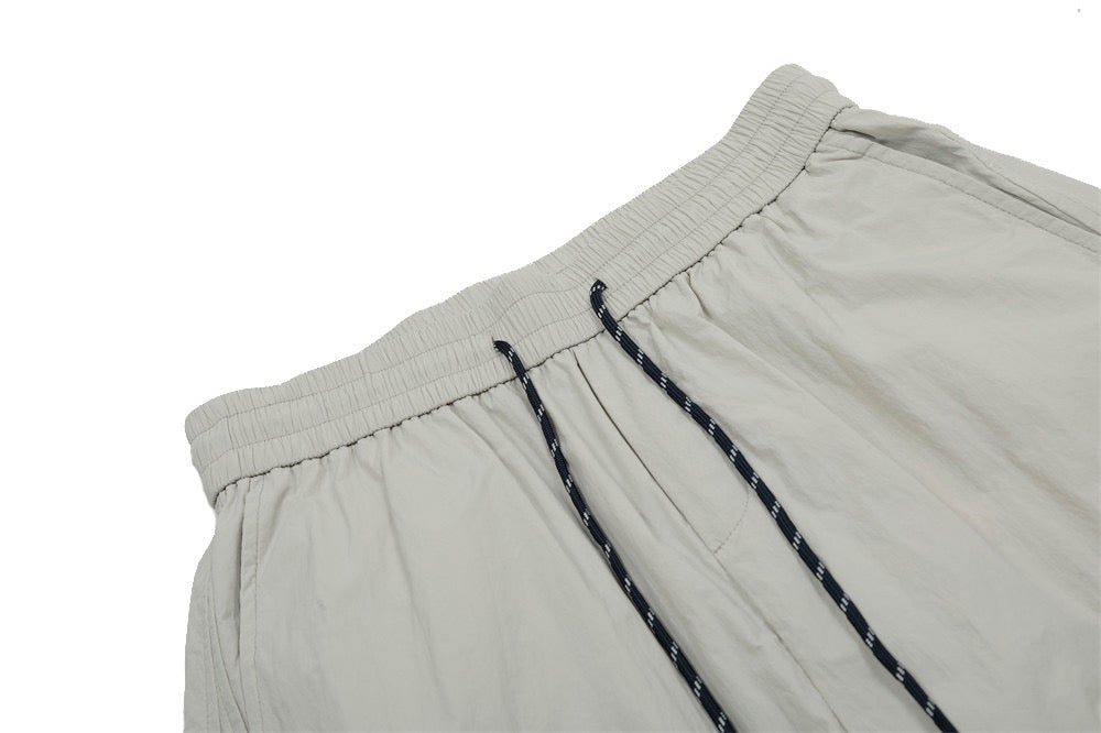Smart Break Wide-Leg Nylon Track Pants | Cream & Black