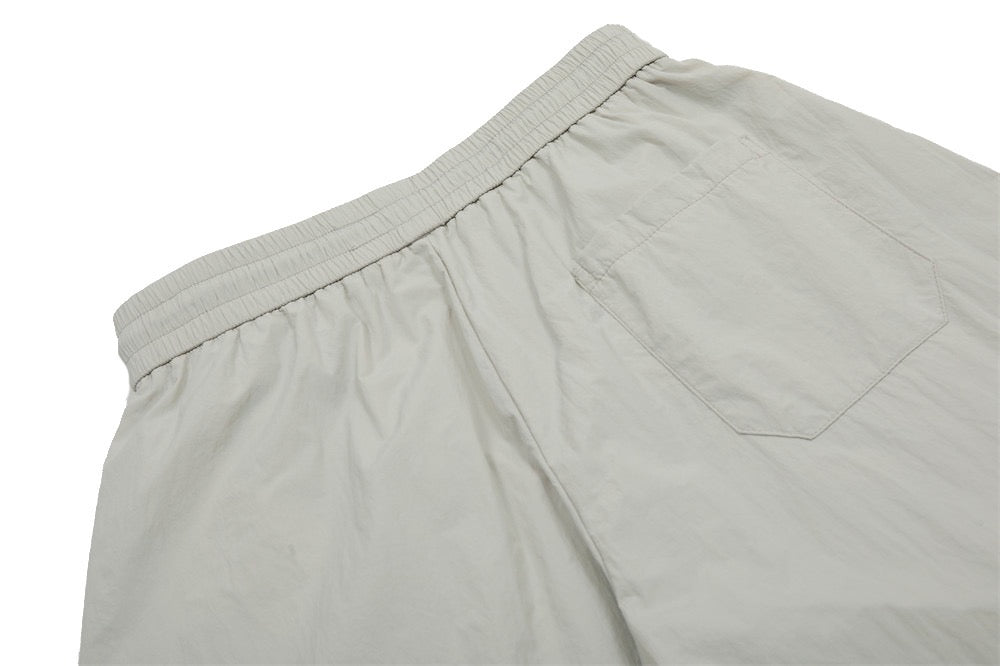 Smart Break Wide-Leg Nylon Track Pants | Cream & Black