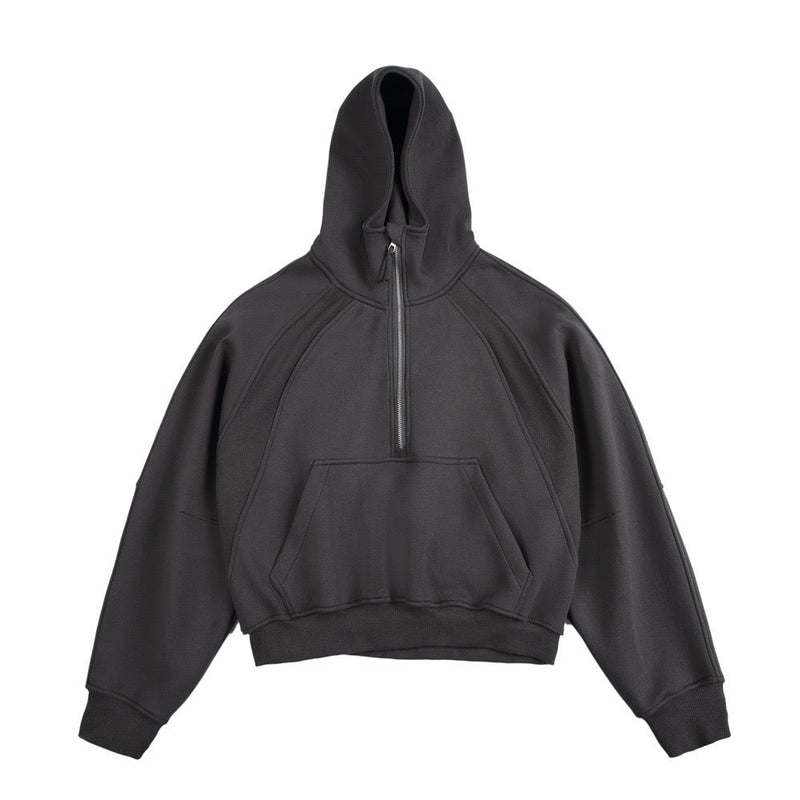 Dark charcoal half-zip cropped hoodie with hood and front pocket, front view