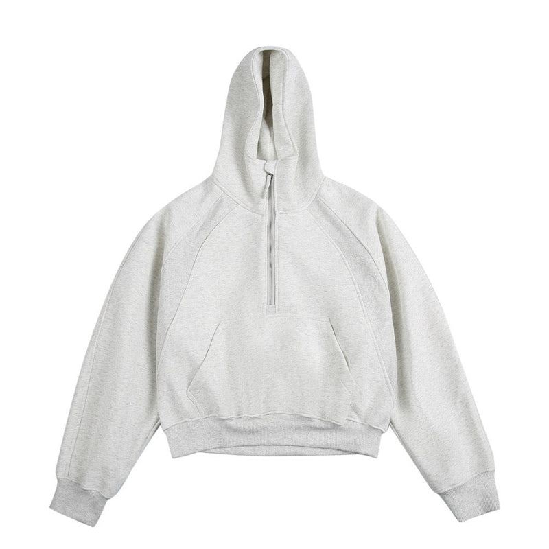 Light gray half-zip cropped hoodie with hood and kangaroo pocket, front view