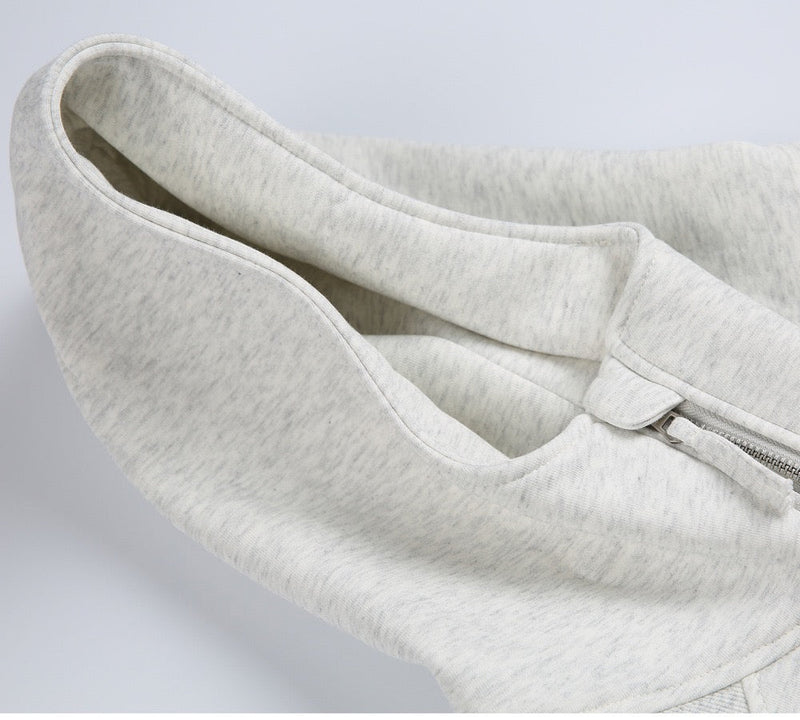Close-up of light gray hoodie hood and half-zip opening