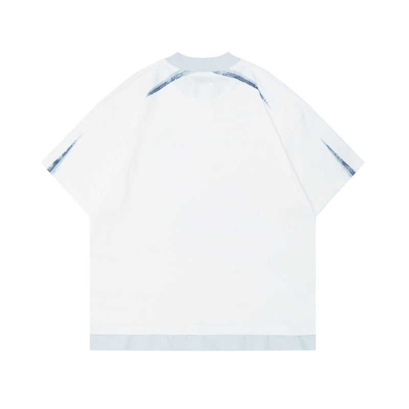White oversized half-zip collar tee with subtle blue panel accents on the shoulders and sleeves, laid flat on a white background