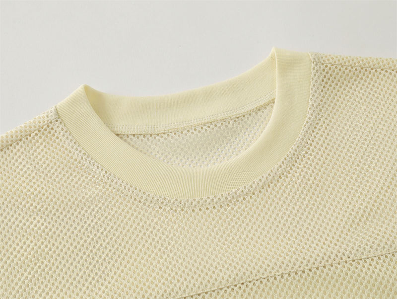 Cream mesh tee with ribbed crew neck and breathable textured fabric detail