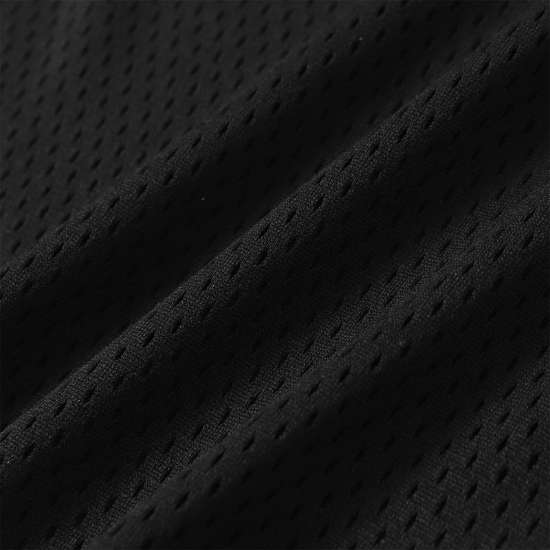 Close-up of black mesh football jersey fabric with a textured, breathable streetwear look
