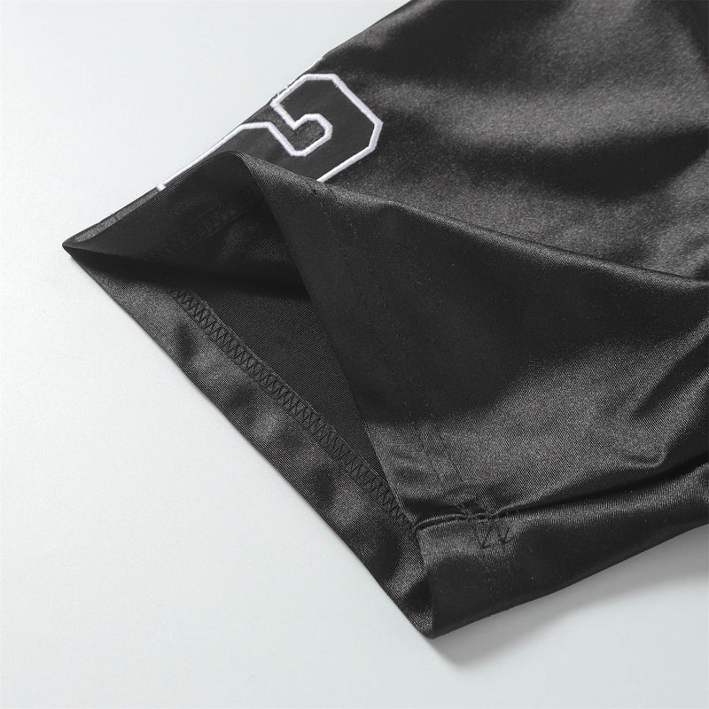 Black mesh football jersey tee with stitched hem and white number detail on lightweight streetwear fabric