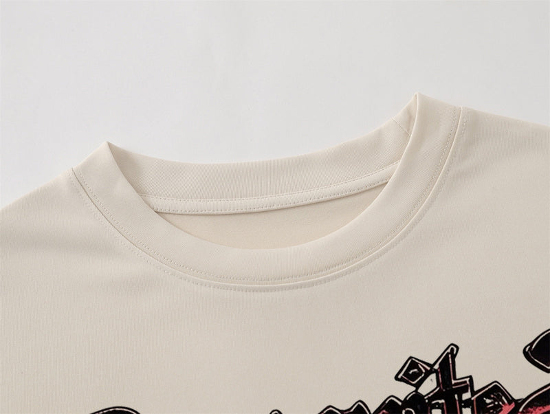 Beige oversized cotton T-shirt with a ribbed crew neck and bold gothic cross graphic print on the chest