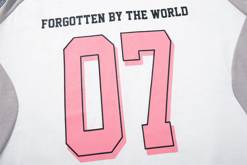 White and gray raglan streetwear tee with pink 07 graphic and Forgotten by the World text on chest