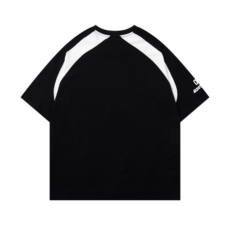 Black and white raglan streetwear tee with oversized fit and sporty varsity-inspired panel sleeves