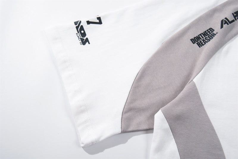 White and gray varsity raglan tee with black graphic prints and retro streetwear details on the sleeve and chest
