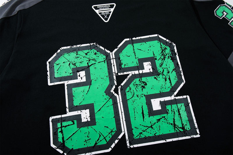 Black varsity graphic tee with large distressed green 32 print and contrast shoulder panels