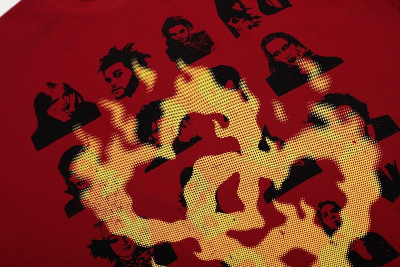 Red streetwear tee with yellow flame graphic and scattered black portrait collage prints