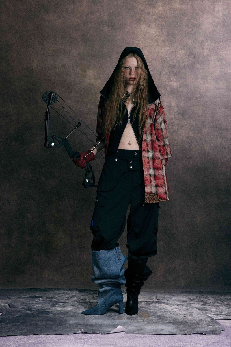 Front view of red plaid patchwork shirt with leopard print trim on model