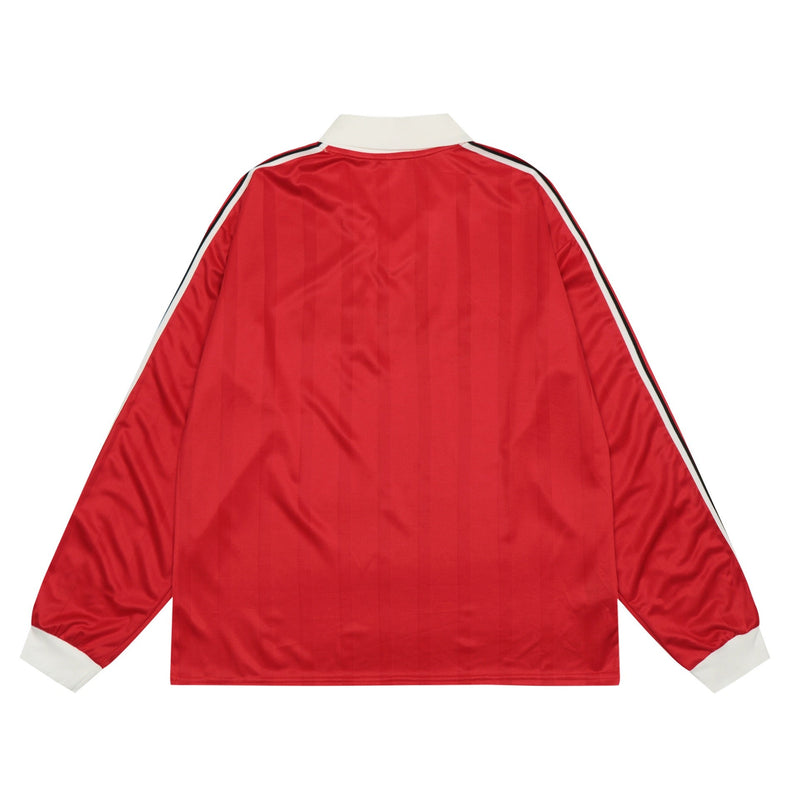Back view of red long-sleeve football jersey with white collar and sleeve stripes