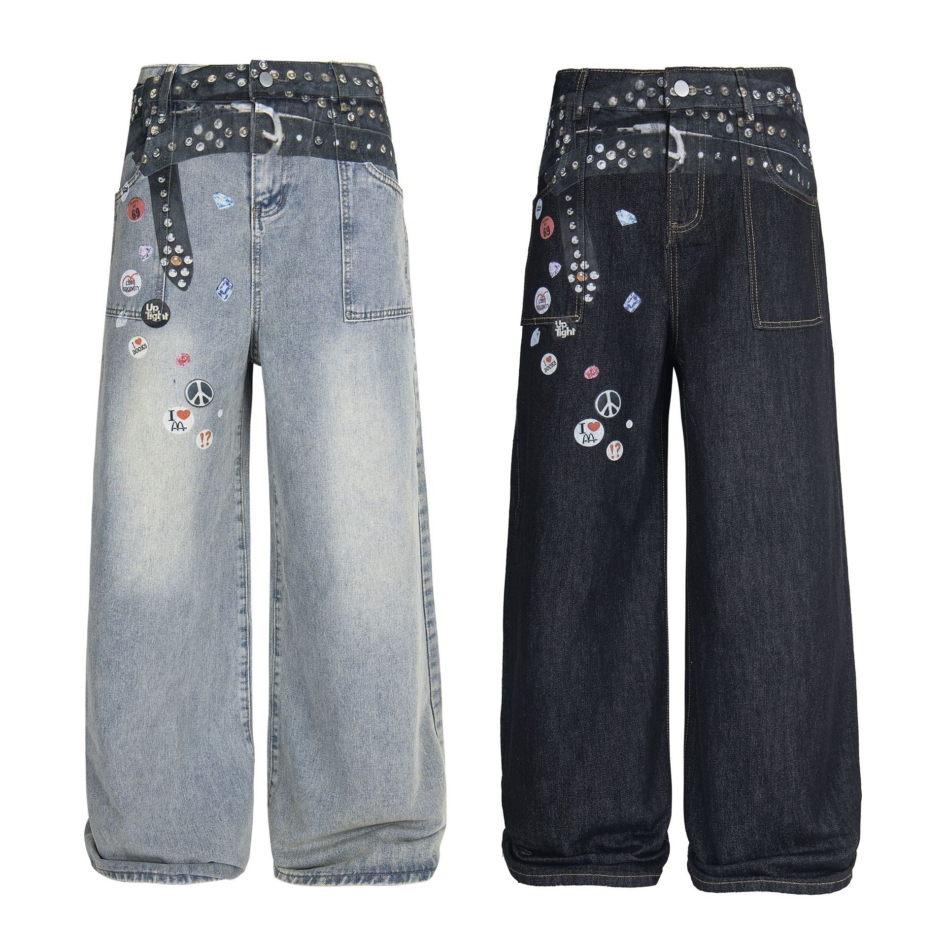 Light wash wide-leg denim pants with silver studs, spray-effect waistband, and scattered badge-style graphic patches