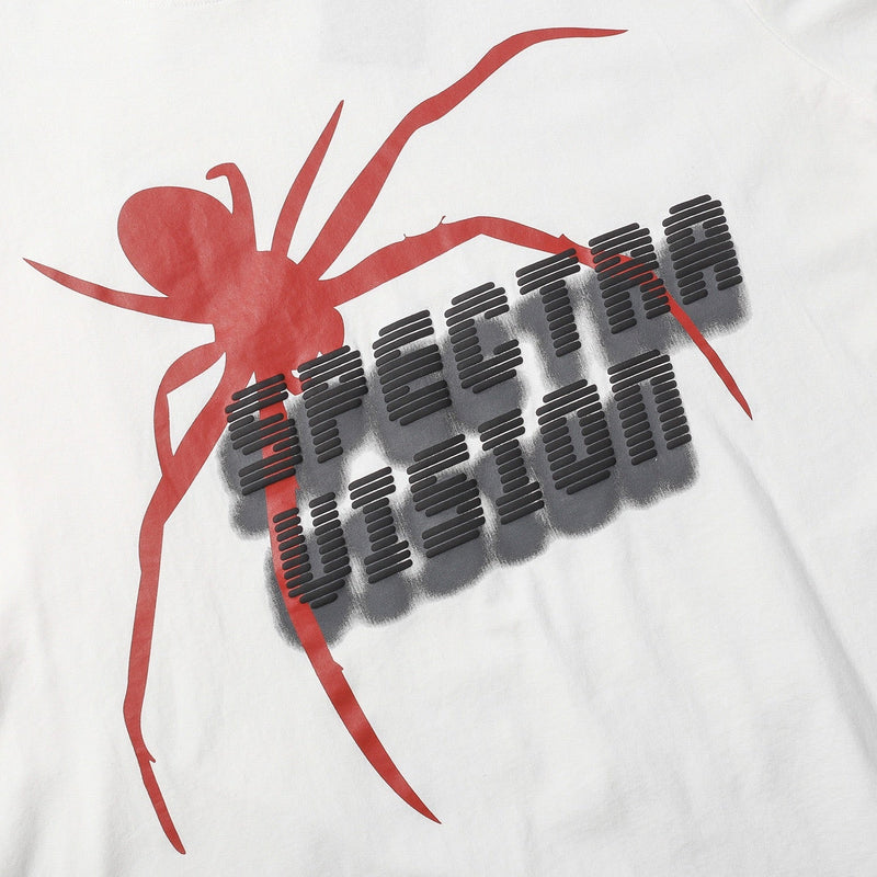White oversized graphic tee featuring a bold red spider and stacked black Seakoff lettering in streetwear style