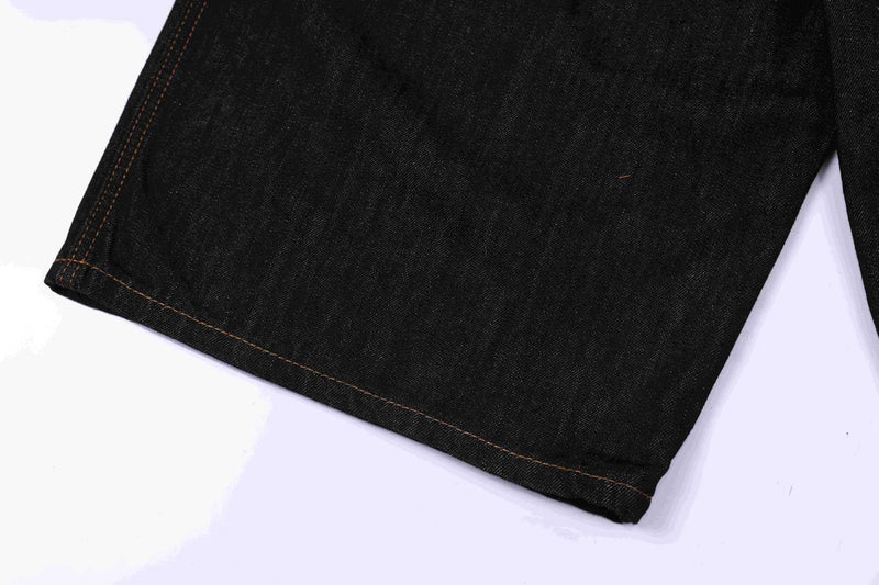 Close-up of dark indigo denim jorts hem with straight stitched cuff