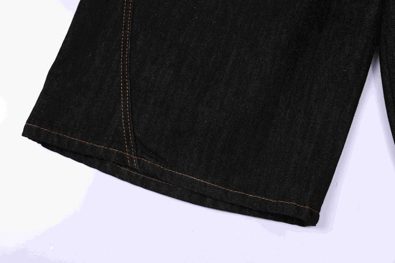 Close-up of dark indigo denim jorts hem with copper topstitching