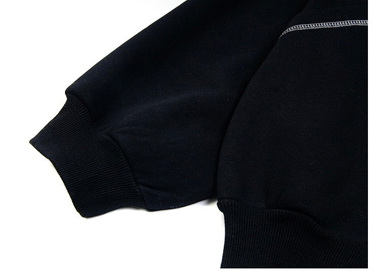 Close-up of black hoodie sleeve cuff and ribbed hem