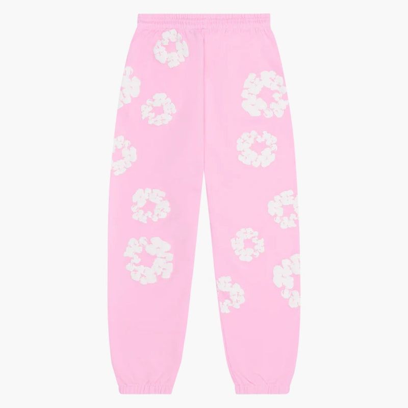 The Pink “Cotton Wreath” Denim Tears Sweatpants feature an elastic waistband and cuffs, and are decorated with a white floral print, combining iconic streetwear style with standout design.