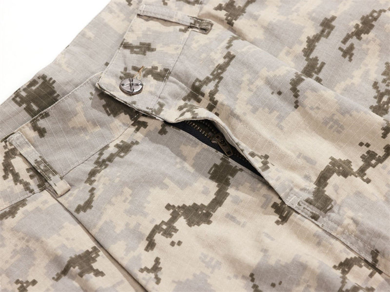 Close-up of partially open cargo pocket flap on desert camo pants