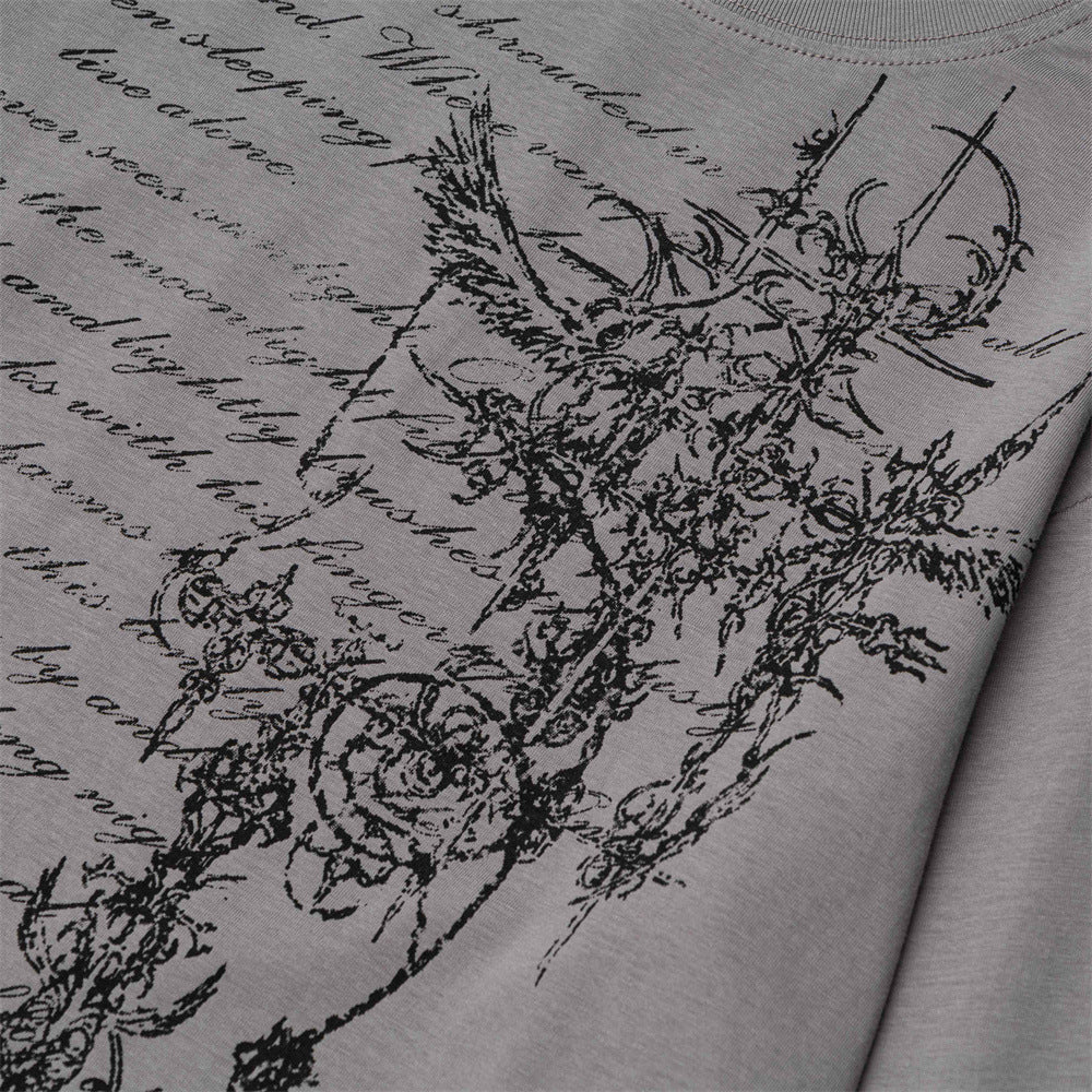 Close-up of gray T-shirt floral cross graphic print on the front