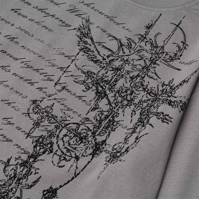 Close-up of gray T-shirt floral cross graphic print on the front
