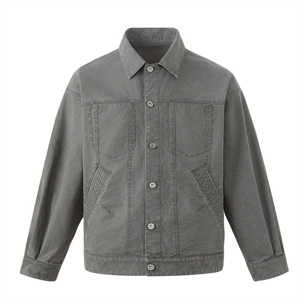 Oversized washed dark grey canvas workwear trucker jacket with multi-pocket design, front and back view