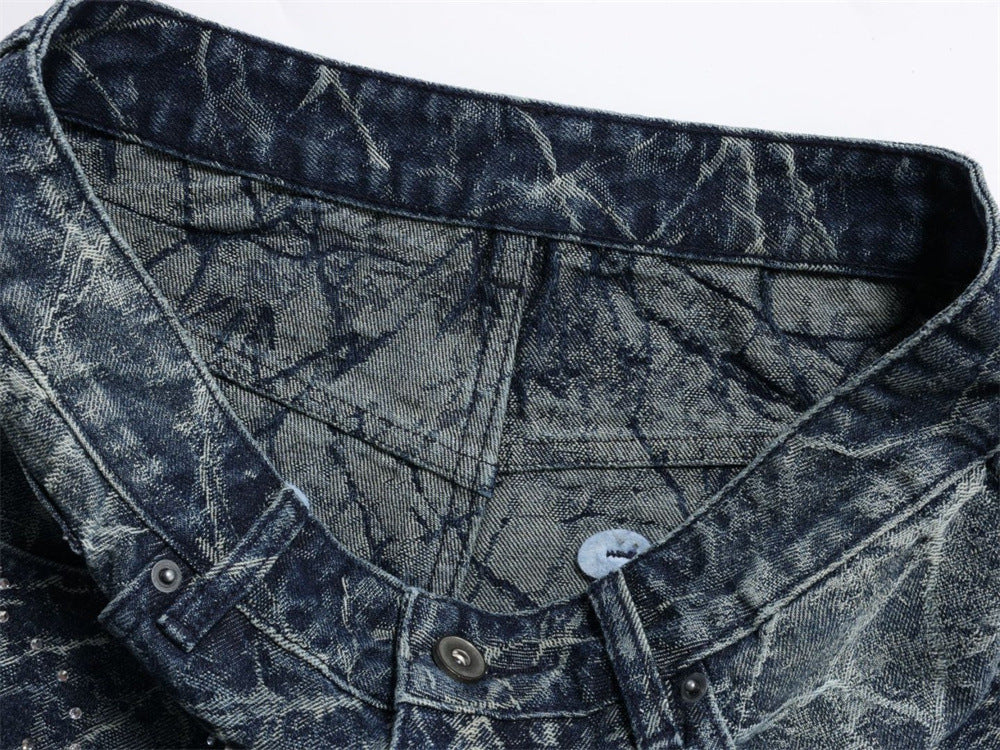 Close-up of inner waistband and front closure on faded blue denim jeans