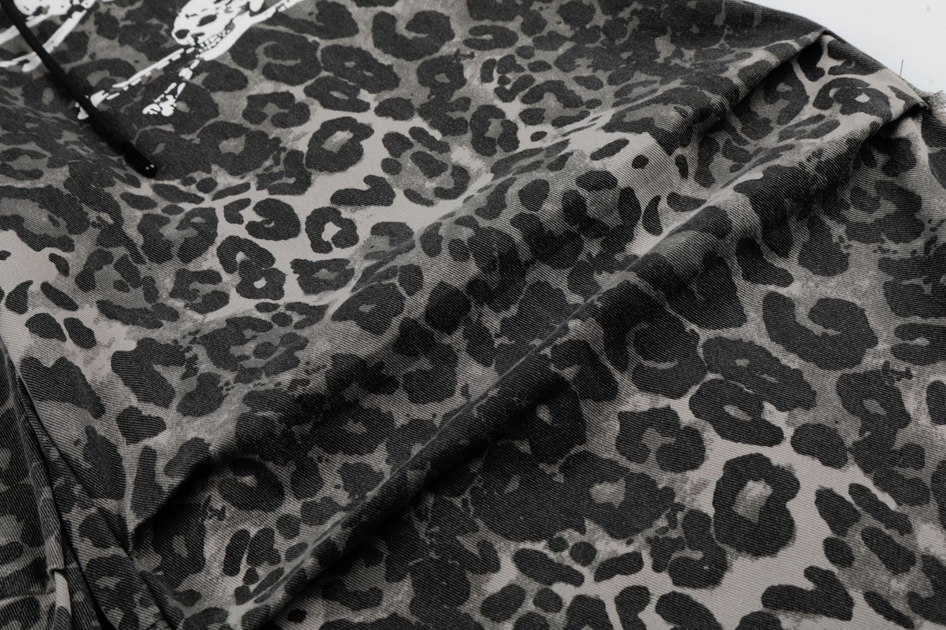 Wide-Leg Leopard Print Pants with Skull & Crossbones Graphic