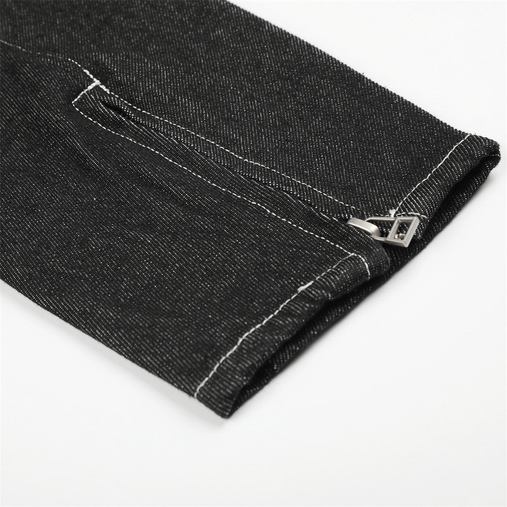Close-up of black denim jacket sleeve cuff with zipper detail