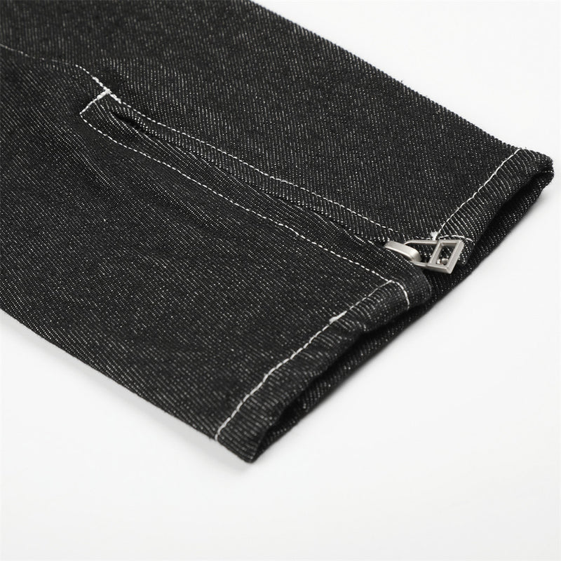 Close-up of black denim jacket sleeve cuff with zipper detail