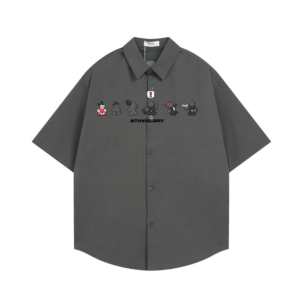 Men's oversized short sleeve button-up shirt with cartoon character sequence chest print in dark grey, front view