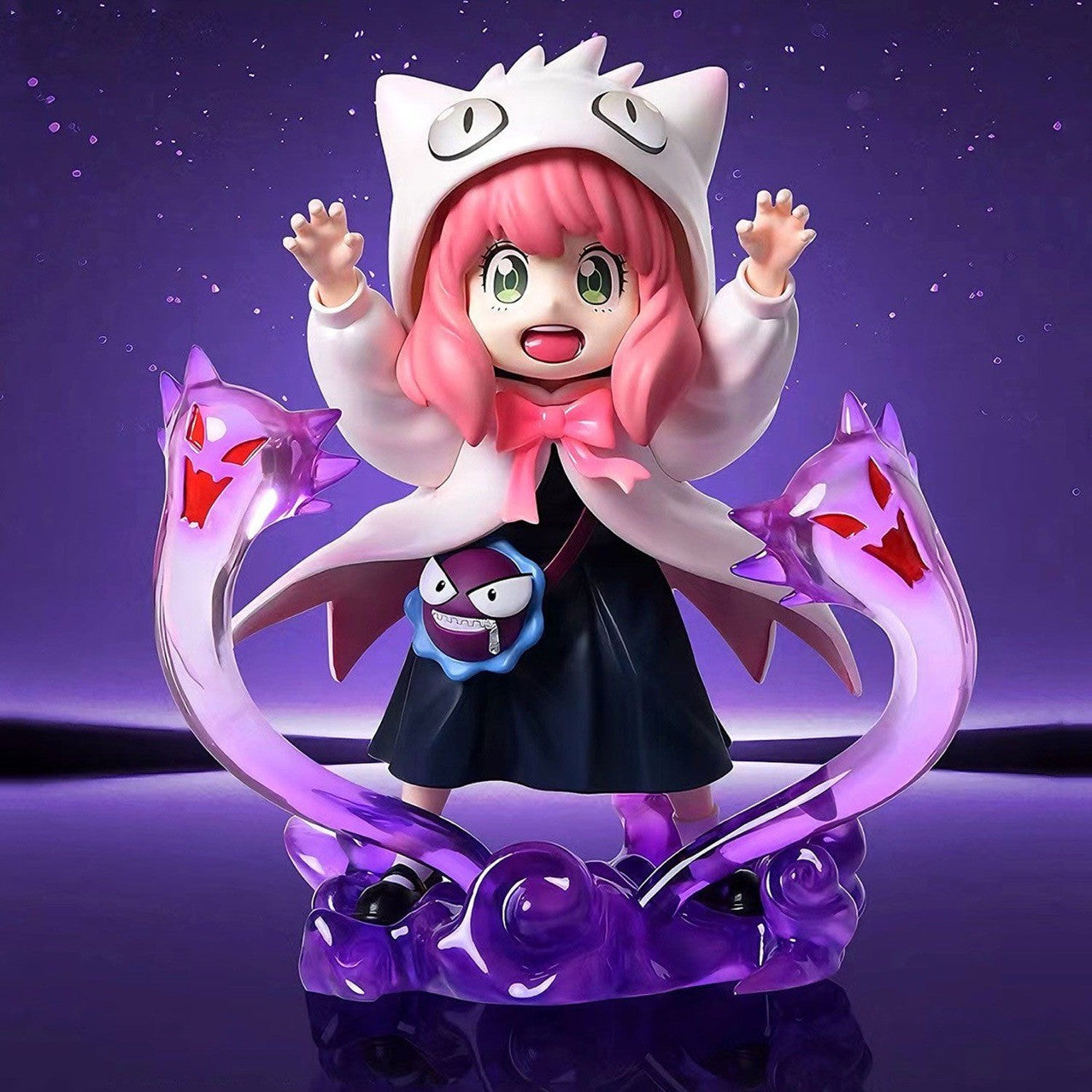 The Spy x Family Anya Forger PVC Figure – 17 cm, by Spy × Family, showcases Anya in a white cat-eared hooded cape and pink hair with raised arms, encircled by two purple serpent-like figures with red eyes against a dark starry sky. Available in Black &amp; White Cosplay Gengar options.