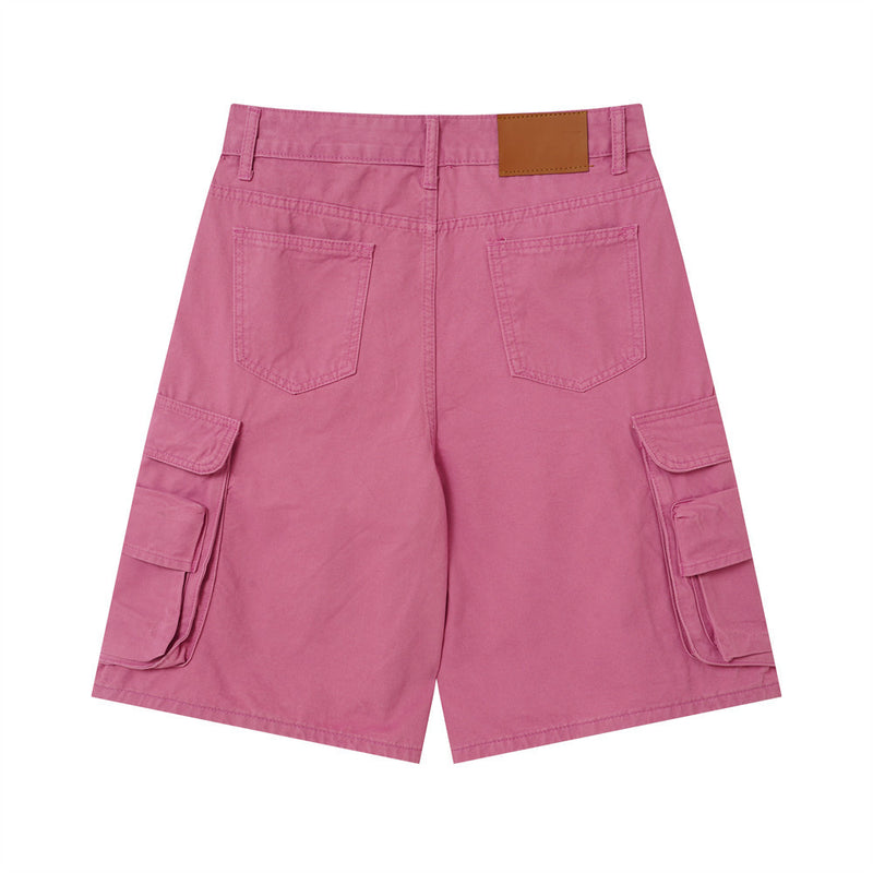 Back view of rose pink cargo shorts with patch pockets and brown waistband label