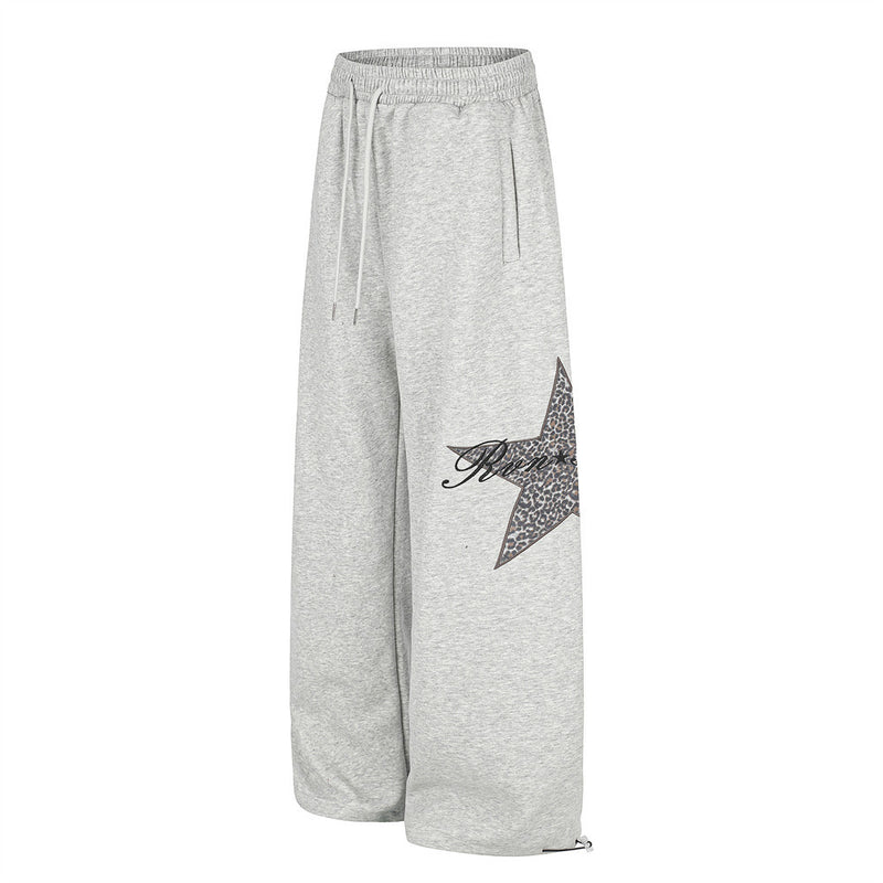 Gray wide-leg sweatpants angled front view with leopard star patch on the leg